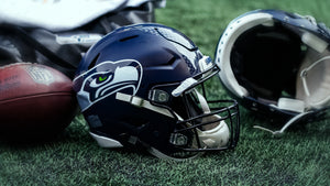 A Seahawks Helmet on turf.